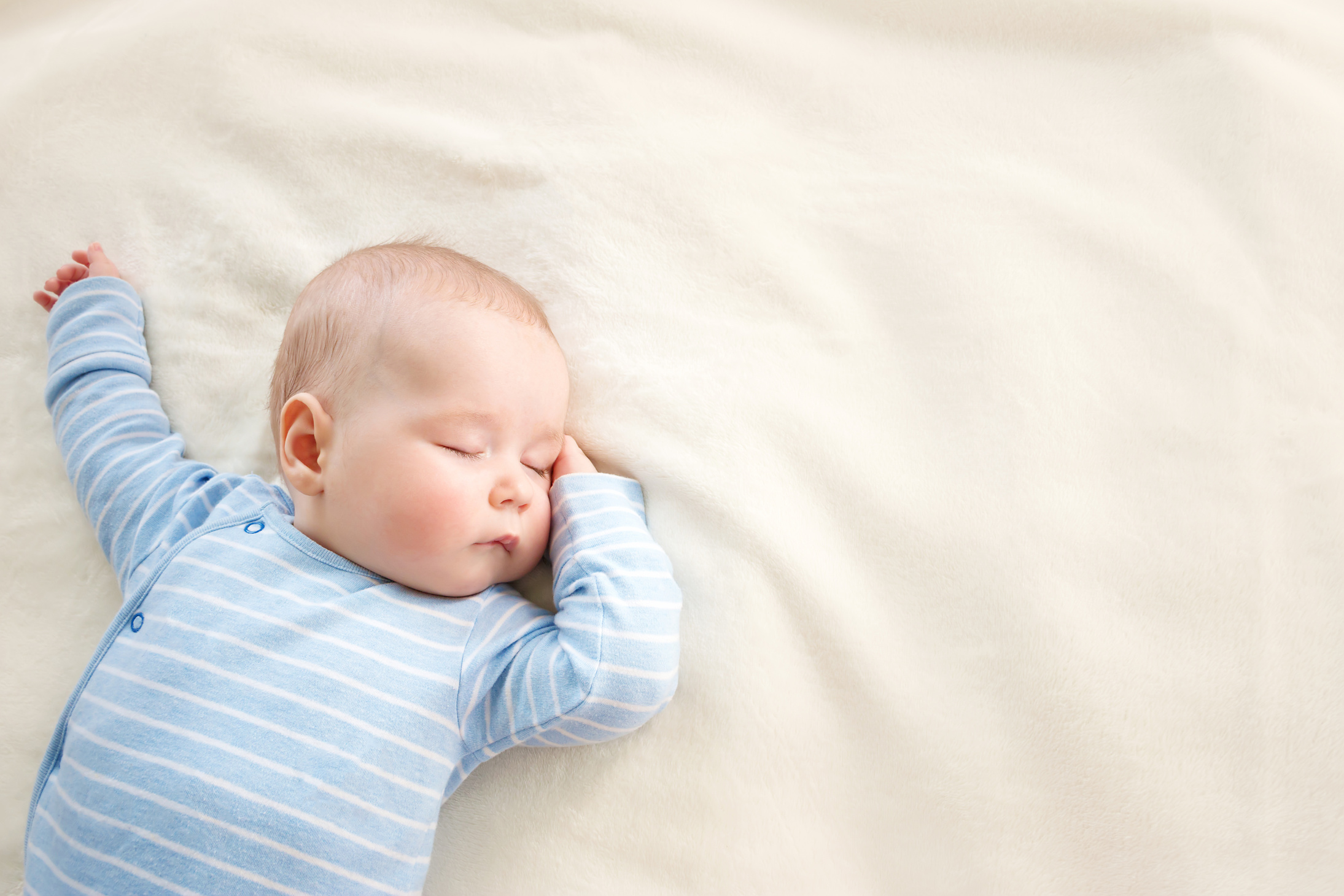 Baby sleeping covered with soft blanket